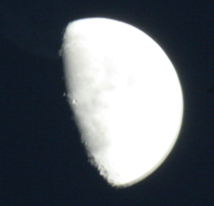 a blurry, over-exposed pic of the moon. The camera doesn't guess exposure time right with high-contrast scenes, so I'll have to figure out how to force the exposure time setting, and probably pick up a remote shutter release dealy.