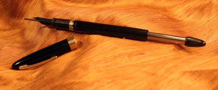 The second pen of the set is a 1950's Shaeffer "Snorkel" fountain pen, and it's possibly the most intricate and baffling mechanism I've ever seen in a pen. This one I may end up sending to a pen restorer just because the parts and tools needed cost as much as a full restoration. :P