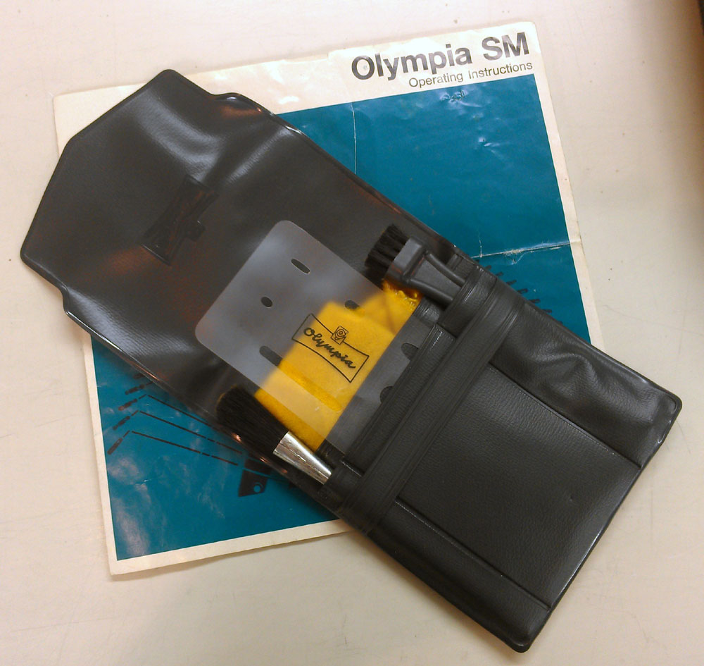 looks like un-used cleaning kit, complete with the Olympia eraser guide!