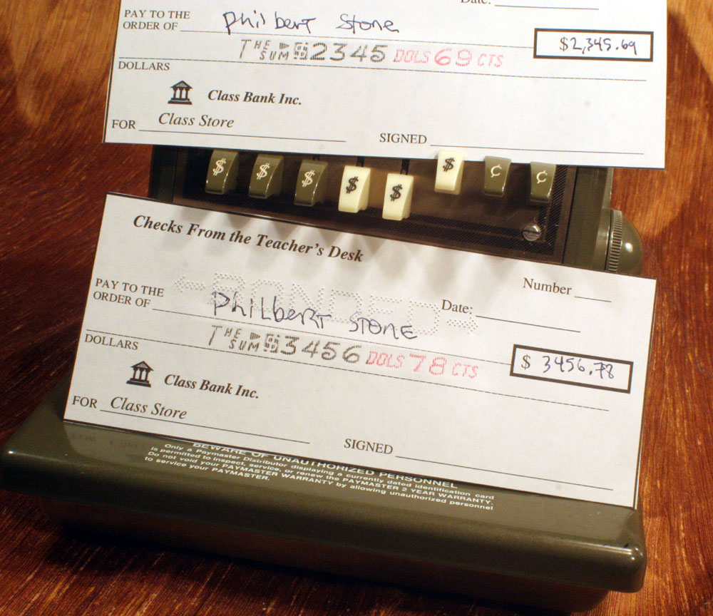 And now you have a check, bottom one is "BONDED" embossed, top one isn't. My checks are gonna be real cool from now on.