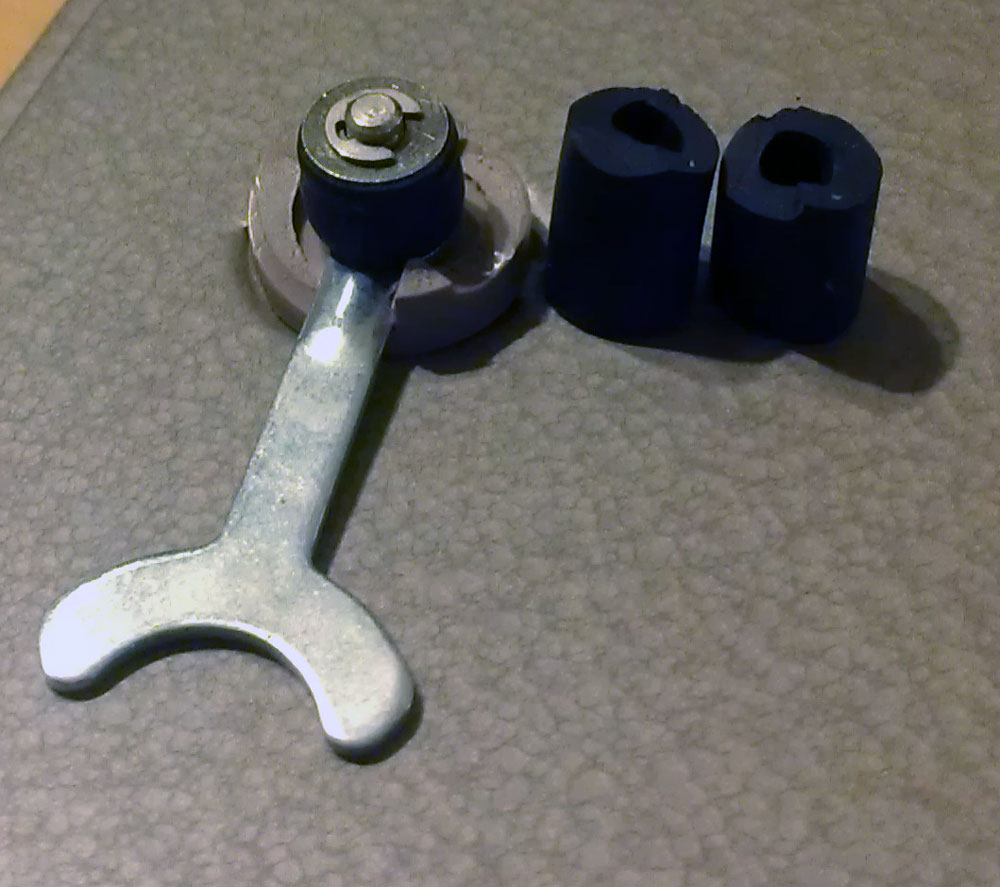 Cut the rubber roughly to size, you can trim it to exact size when you fit the washer and c-clamp back on.